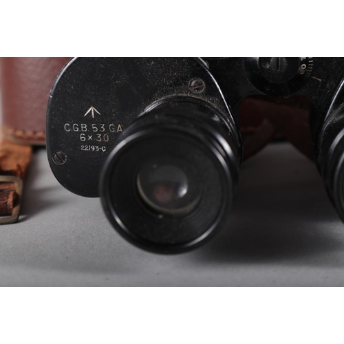 141 - A Zeiss Ikona 35mm camera and a pair of military binoculars, in case