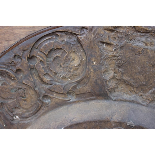 152 - A circular embossed copper plaque, traces of gilding, centre with Battle of Anghiari after Leonardo,... 