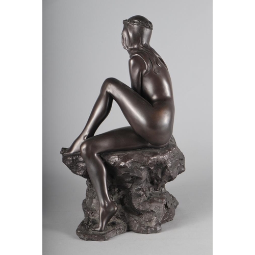 208 - An Elton cold cast bronze figure of a nude on a rock, 16