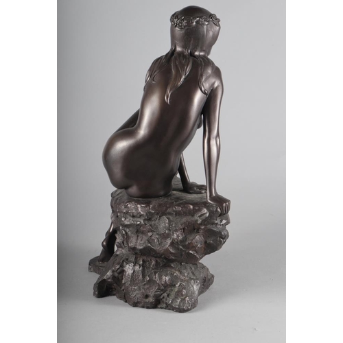 208 - An Elton cold cast bronze figure of a nude on a rock, 16