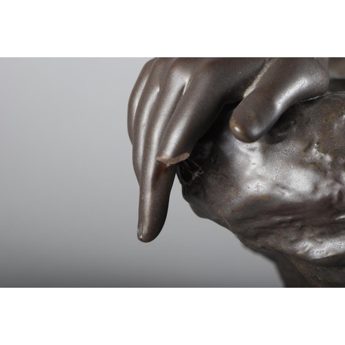 24 - A bronzed Lladro sculpture of a nude woman resting on a rock, base signed 