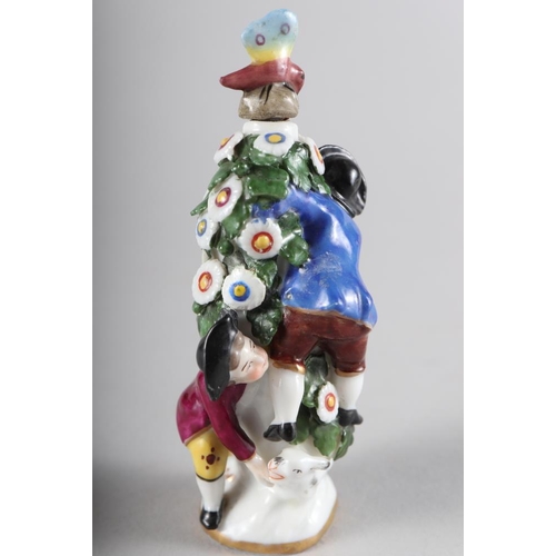 249 - A Continental porcelain scent bottle, in the Chelsea manner, figures round a flowering bush, 4