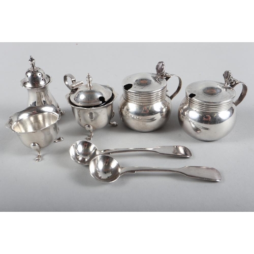 256 - A silver three-piece cruet set, two silver mustard pots and two silver mustard spoons, 7.9oz troy ap... 