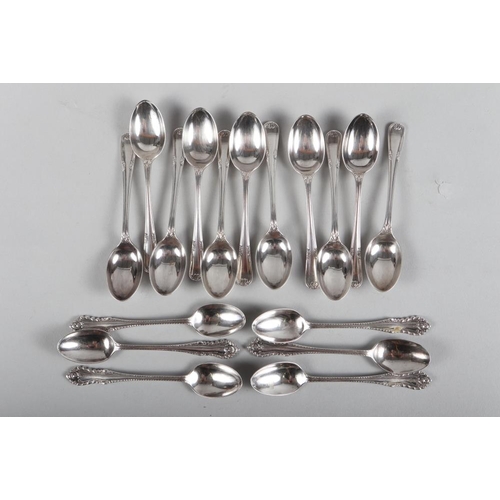 257 - A set of six silver teaspoons with gadrooned borders and eleven other silver teaspoons, 8.1oz troy a... 