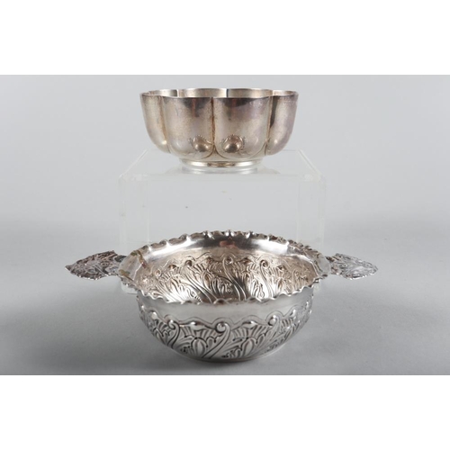 258 - A silver bowl with lobed decoration and an embossed silver two-handled bowl, 7.5oz troy approx