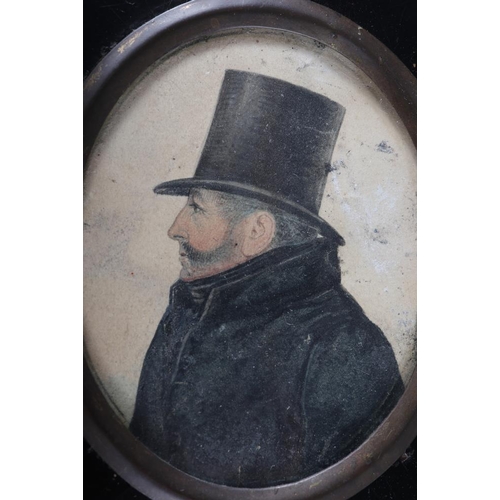 329 - Two 19th century portrait miniatures of gentlemen, in ebonised frames, and a pair of silhouette port... 