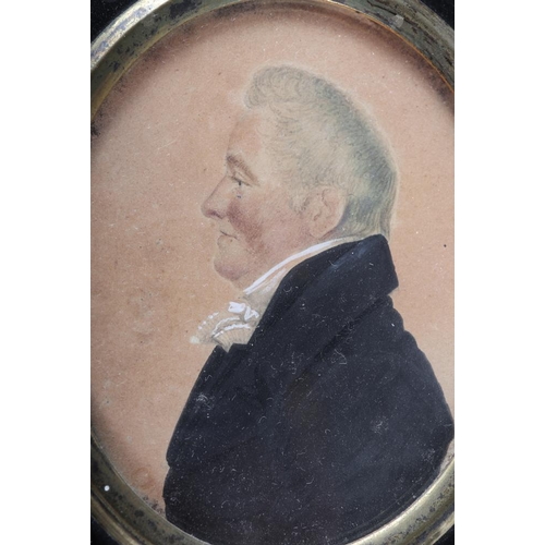 329 - Two 19th century portrait miniatures of gentlemen, in ebonised frames, and a pair of silhouette port... 