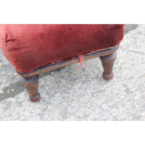 370 - A 19th century mahogany framed long footstool, upholstered in a red velvet, and a circular mahogany ... 