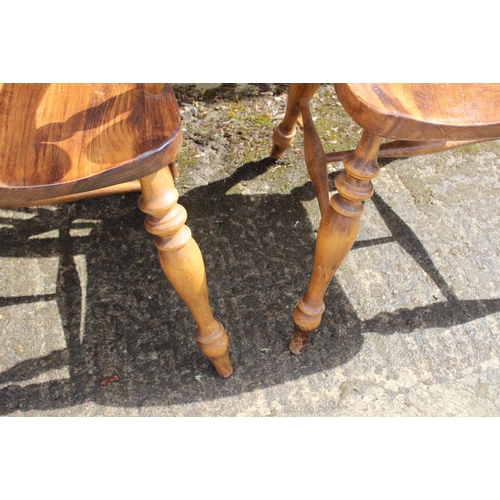 371 - A pair of 19th century Windsor lath back kitchen armchairs