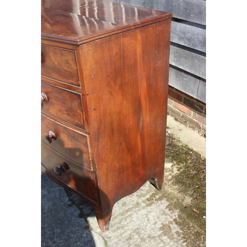 377 - An early 19th century bowfront mahogany chest of two short and three long drawers, 42