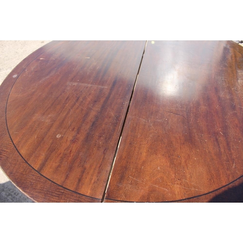 380 - A 19th century mahogany and ebony strung two-section extending dining table with two extra leaves, o... 