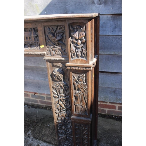 386 - A 19th century carved oak fireplace surround with frieze panel carved figures, horses and windmill, ... 