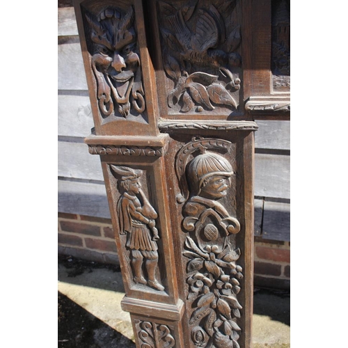 386 - A 19th century carved oak fireplace surround with frieze panel carved figures, horses and windmill, ... 