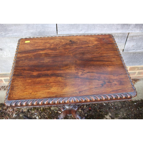 398 - A 19th century carved rosewood occasional table, on turned column and quadruple acanthus scroll supp... 