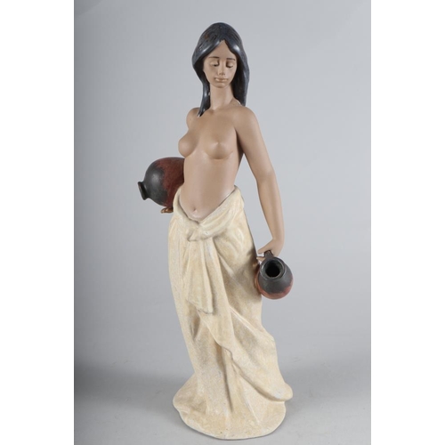40 - A Lladro Gres figure of a semi-nude woman, 