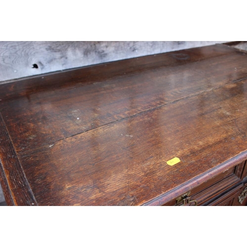 407 - An early 18th century oak two-section chest on stand of four drawers with panelled fronts, 40