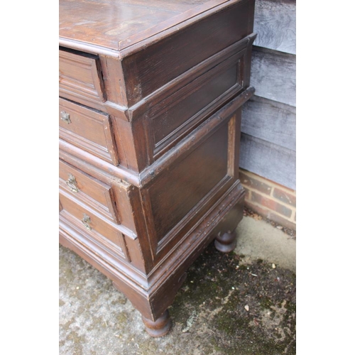 407 - An early 18th century oak two-section chest on stand of four drawers with panelled fronts, 40