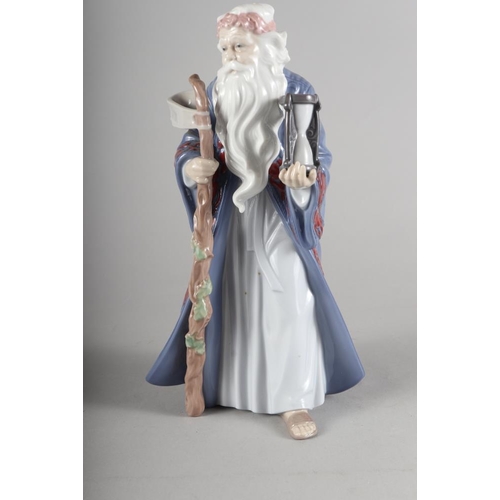 41 - A Lladro Millennium porcelain figure of an old bearded man representing Time, 10