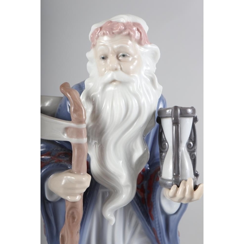 41 - A Lladro Millennium porcelain figure of an old bearded man representing Time, 10