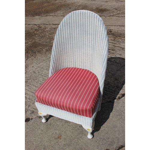 428 - A Lloyd Loom low seat nursing chair with drop-in seat, on cabriole supports