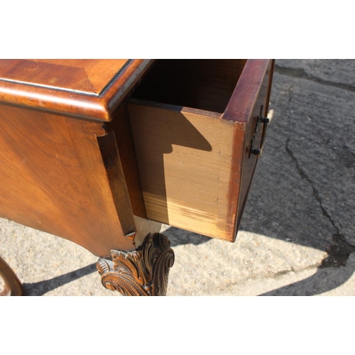 439 - A Georgian design walnut serpentine front dressing/writing table, fitted three drawers, on carved ca... 