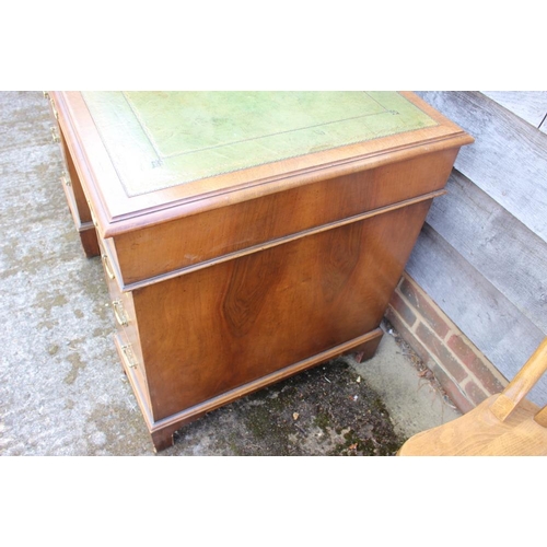 469 - An early 20th century walnut double pedestal desk with green leather tooled lined top over nine draw... 