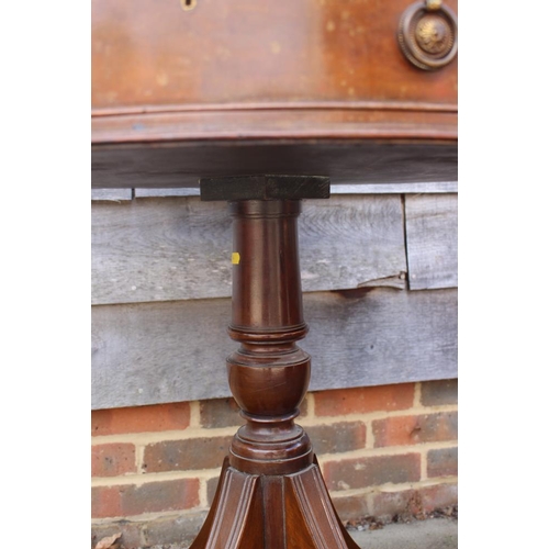 471 - A mahogany drum table with tooled lined gilt green leather top, fitted three drawers, on turned colu... 