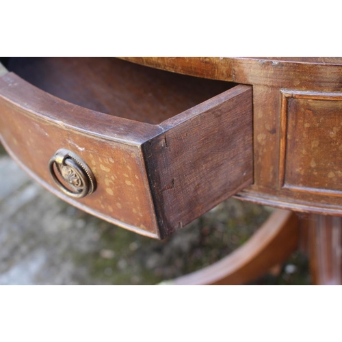 471 - A mahogany drum table with tooled lined gilt green leather top, fitted three drawers, on turned colu... 