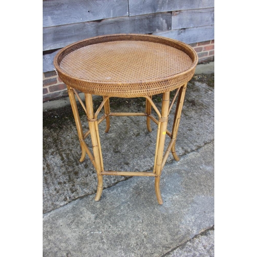 479 - A rattan tray top circular table, 25