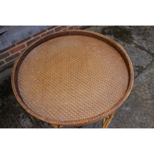 479 - A rattan tray top circular table, 25