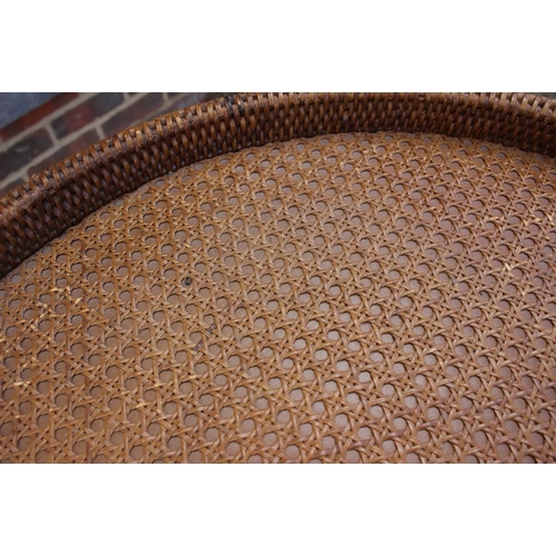 479 - A rattan tray top circular table, 25