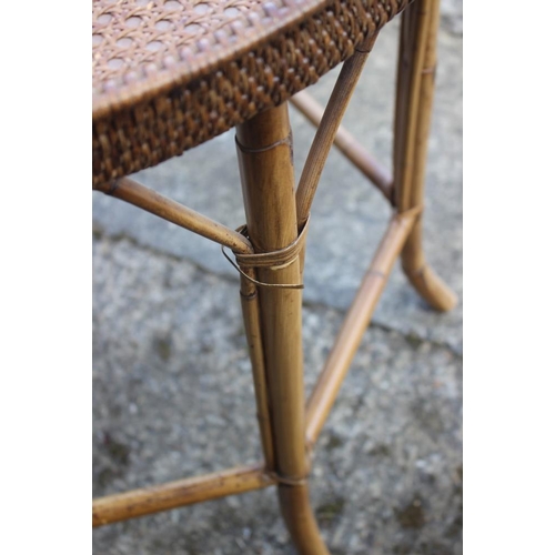 479 - A rattan tray top circular table, 25