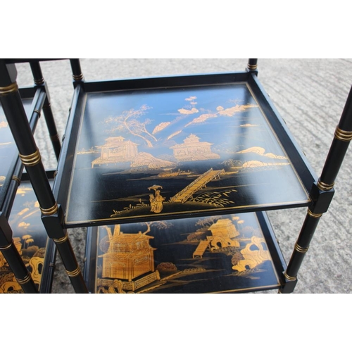 480 - A pair of Oriental design black and gold lacquered three-tier tables