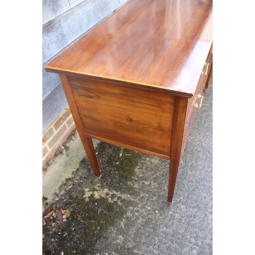 486 - An Edwardian mahogany and satinwood banded chest of two short and one long drawer, on square taper s... 