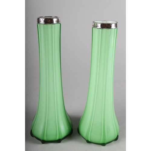 49 - A pair of early 20th century green and white overlaid tapering vases with silver mounts, 8 1/4