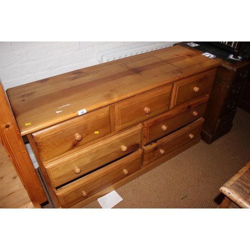 497 - A waxed pine chest of three small and four large drawers, on block base, 51