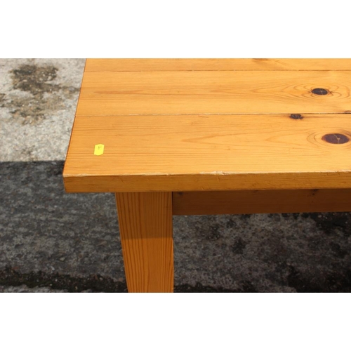 506 - A pine rectangular top kitchen table, on square taper supports, 59