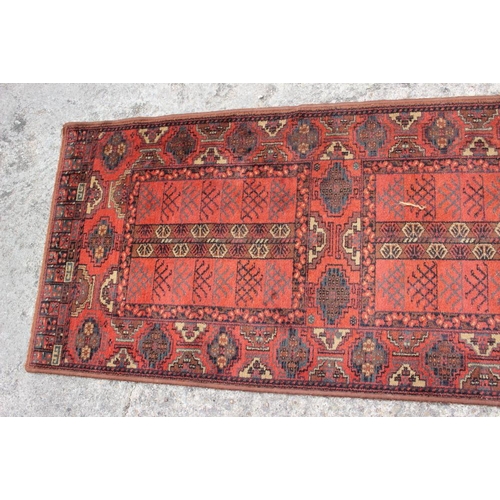 514 - A Mossoul wool pile runner of traditional Persian design in shades of rust, blue, brown and blue, 26... 