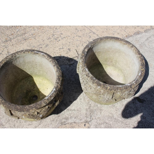 531 - A pair of cast stone planters with grape decoration, 15