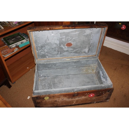 538 - A leather trunk, fitted brass lock, and a metal bound wooden trunk, stencilled Hunnings, 37