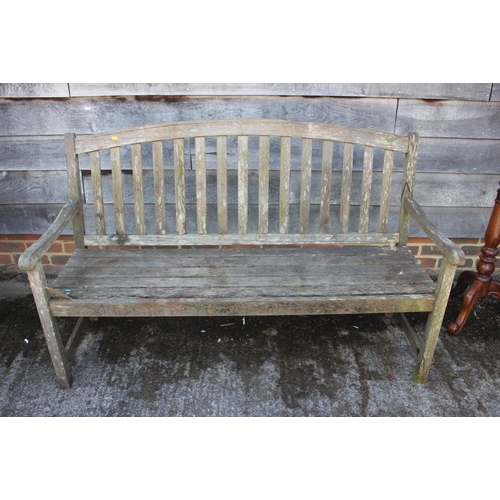 540 - A teak slat back garden settle 37 1/2