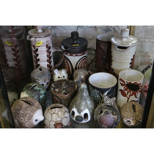 86 - A quantity of studio pottery coin banks, formed as various animals, including Briglin, various studi... 