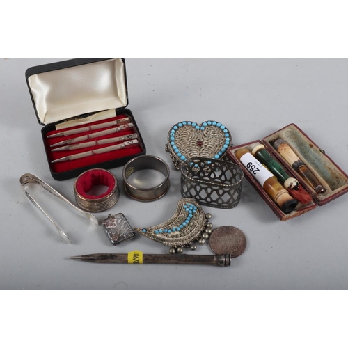 259 - An amber, meerschaum and silver mounted cigarette holder, a similar cigar holder, in fitted case, a ... 