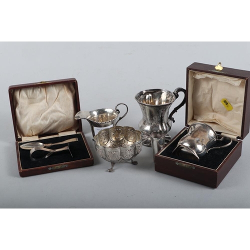 260 - A silver christening cup, in box, a spoon and pusher, in box, a Victorian silver christening cup, an... 