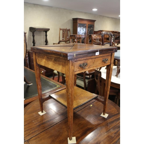 362 - An Edwardian rosewood and inlaid envelope card table, on square taper supports united by an undertie... 