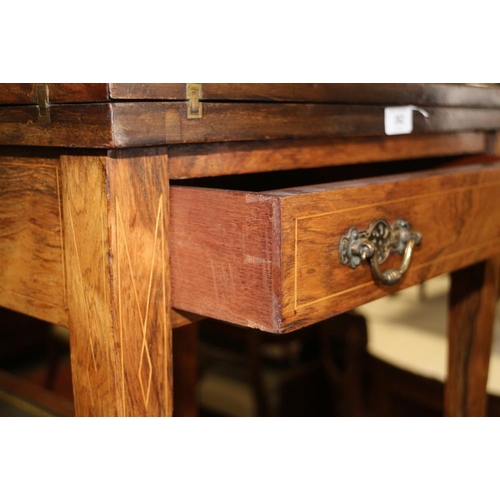 362 - An Edwardian rosewood and inlaid envelope card table, on square taper supports united by an undertie... 