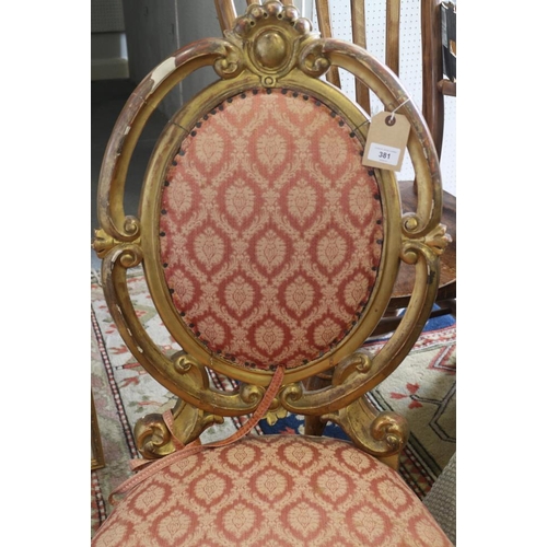 381 - A pair of French giltwood framed salon chairs with oval backs, upholstered in a pink brocade, on cab... 