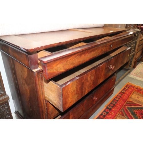 410 - A 19th century mahogany chest of three long drawers with turned handles, 50