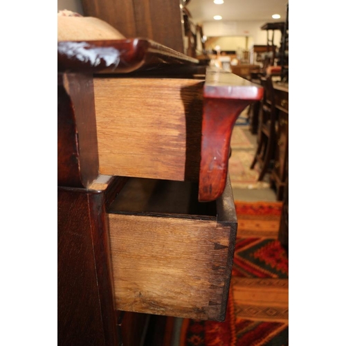 410 - A 19th century mahogany chest of three long drawers with turned handles, 50