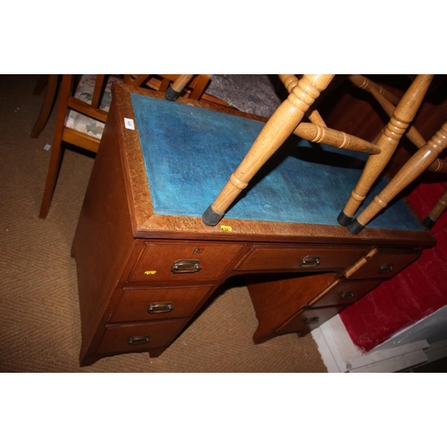 429 - A burr maple double pedestal desk with blue tooled lined top over seven drawers, on bracket feet, 40... 